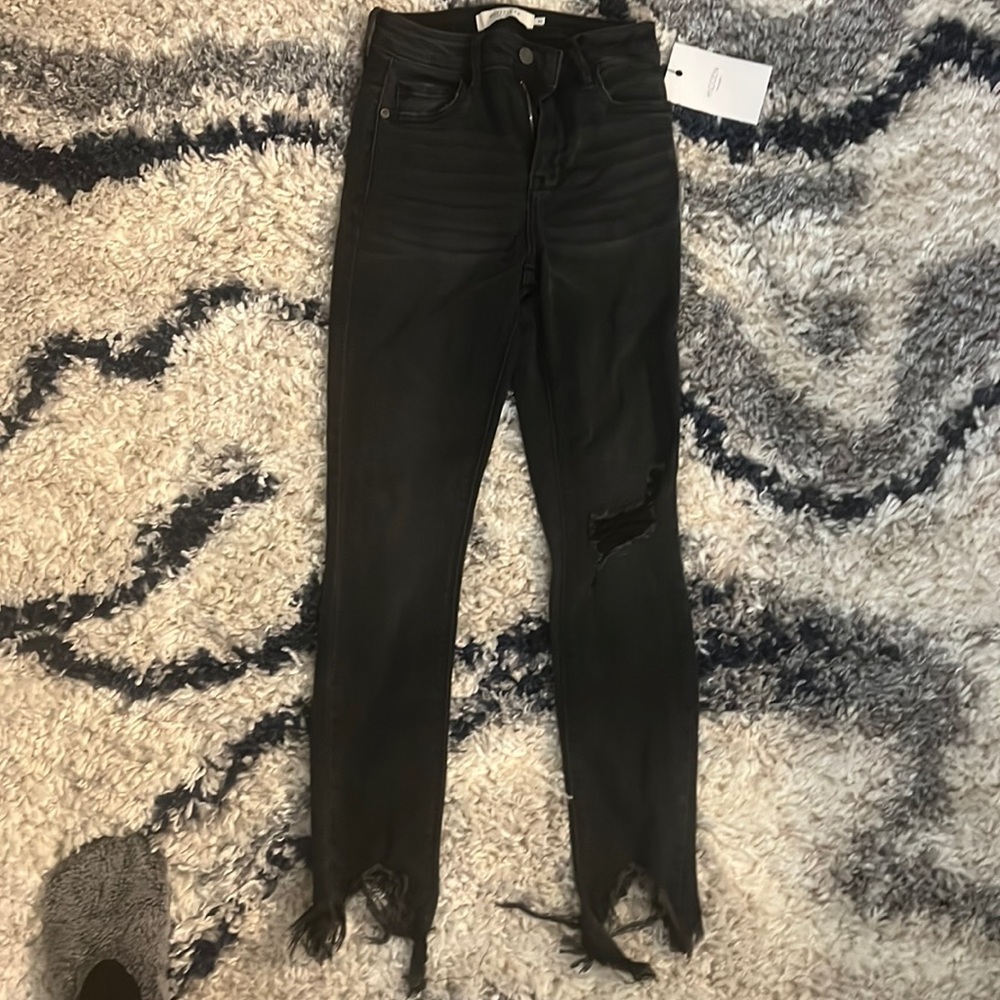 NWT VICI black distressed jeans , women’s size 24, never worn sold out on site.
